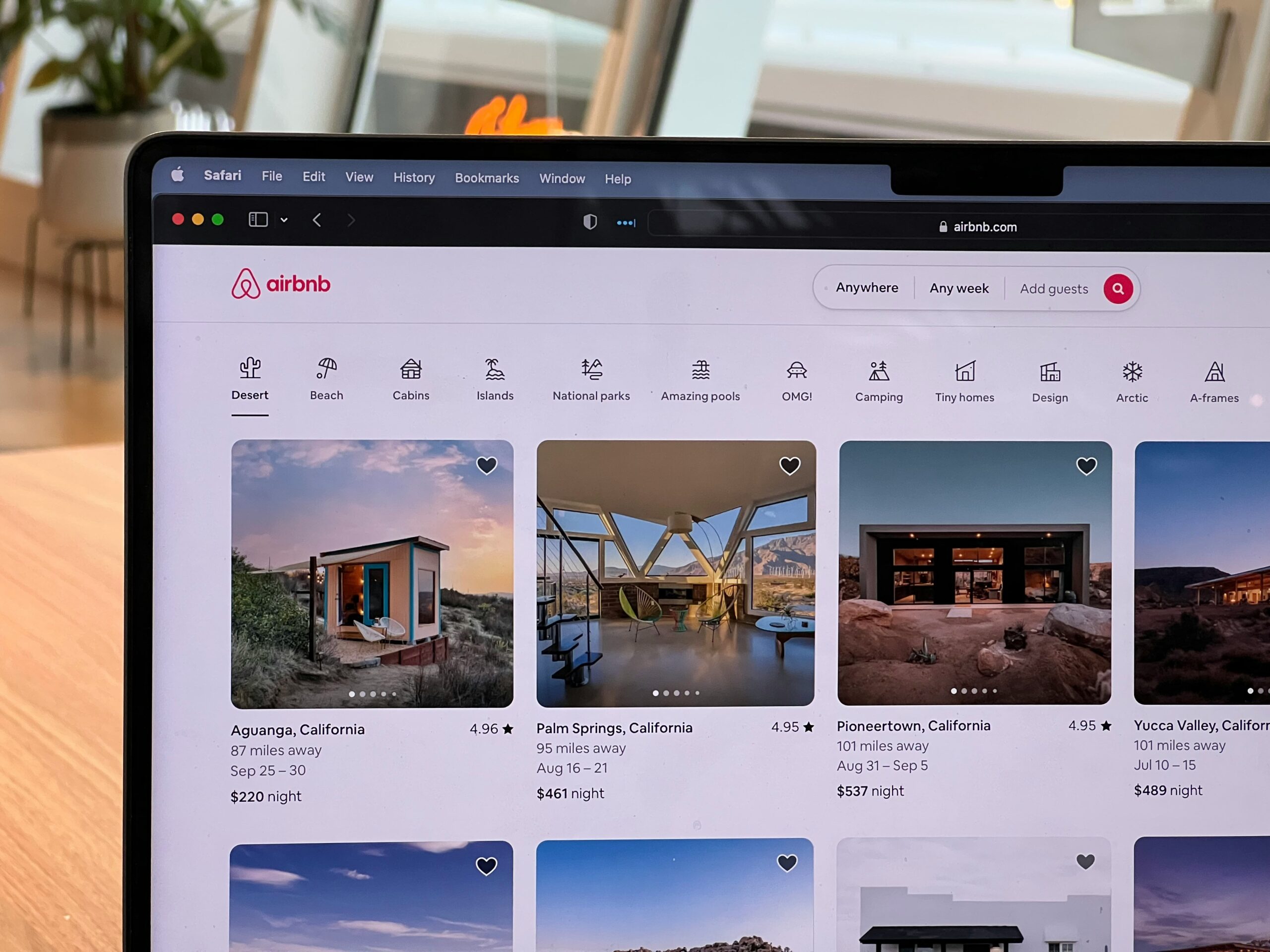 laptop open to airbnb website.